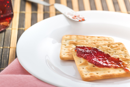 Breakfast cracker biscuit with jamの写真素材