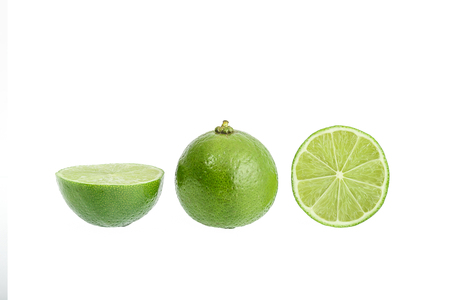 Citrus lime fruit with slice and half isolated on white background with clipping pathの写真素材