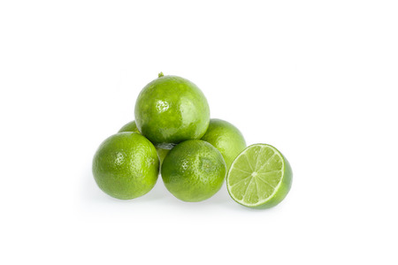 Citrus lime fruit with slice and half isolated on white background with clipping pathの写真素材