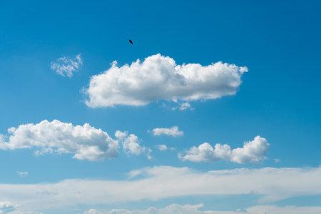 Blue sky background with beautiful cloudsの写真素材