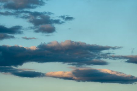 Blue sky background with beautiful cloudsの写真素材