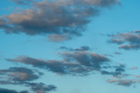 Blue sky background with beautiful cloudsの写真素材