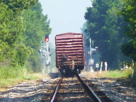 a freight train rolling down the tracks early morningのeditorial素材