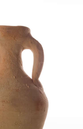 Ancient pottery which was the most common method of transporting goods such as wine in ancient times. Isolated on white.の写真素材