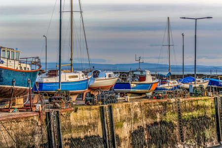 Boats on a quayside, out of the water for winterの写真素材
