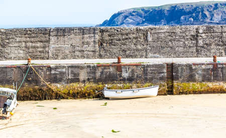 An harbour with small fishing boats at low tideの写真素材