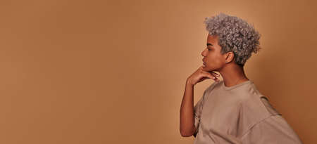 Profile portrait African female with beaming smile plump lipsの写真素材