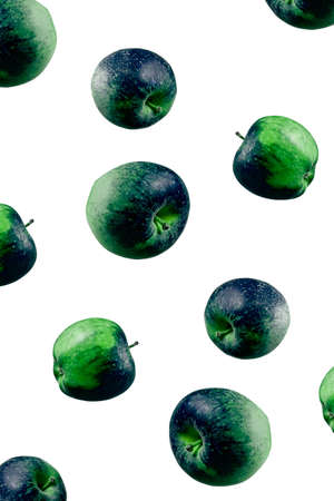 Space and earth planet concept in food. Apples visually similar to Earth planet. Abstract creative fruits. Apples falling from top to bottom. Open composition. Close-up. Isolated on white background.の写真素材