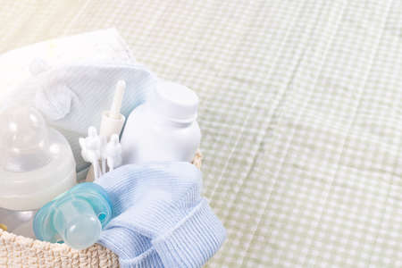 Newborn baby care products. Powder, diapers, baby's nipple, bottle, ears stocks on changing pad....