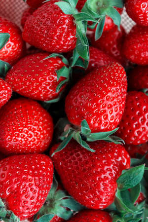 Tasty ripe fresh red strawberries background. Summer and healthy food concept. Close up. Top view.