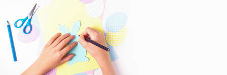 Easter activities. Dot to dot painting bunny game. Line art easter rabbit game for children. Dot to dot drawing activity page. Selective focus. Top view. Banner with copy space.の写真素材