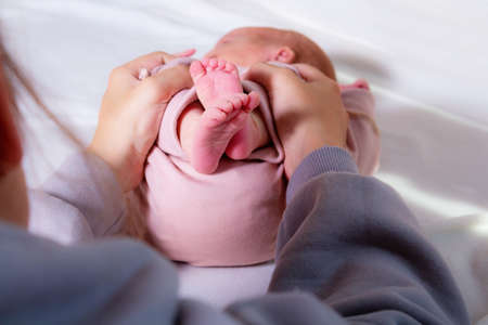 Massage for newborn baby against abdominal pain.の写真素材