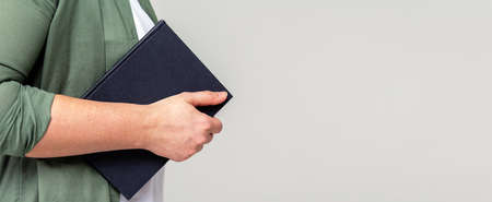 Office banner. Unrecognizable woman, planner, copy space.