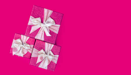 Banner with pink gift boxes. right copy space. holiday presents. Shopping, sale banner. top view.の写真素材