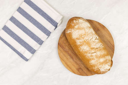 Flatlay above homemade bread on the wooden board with copy space