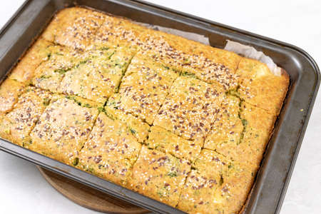 Baked Cornbread with Spinach in the baking tray.