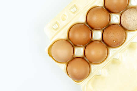 Full box with eggs isolated above white background with copy space.の写真素材