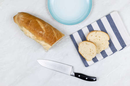 Flatlay above grey marble table with smoked ham sandwiches breakfast.
