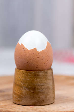 Boiled egg for breakfast on the wooden holderの写真素材