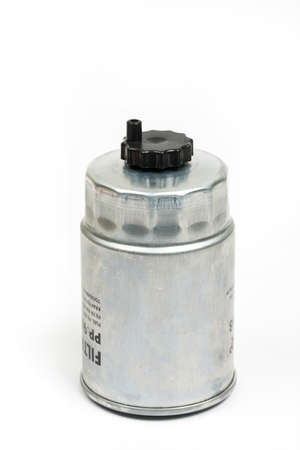 Metal car fuel filter isolated over white backgroundの写真素材