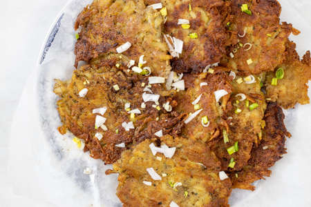 Fried grated potatoes pancakes served on the plate.の写真素材