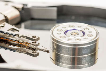 Inside opened pc hard disc isolated over white background.