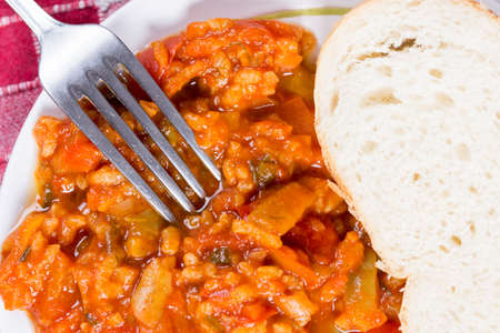 Thick tomato stew with rice and pepper.