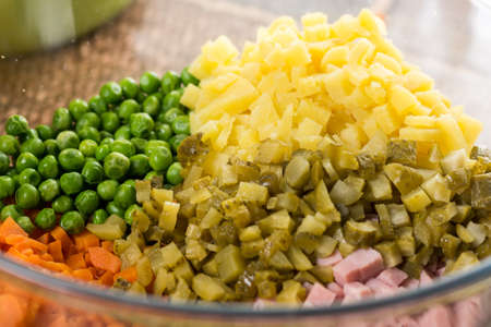 Flat lay image chopped pickles green peas carrot and potatoes.の写真素材