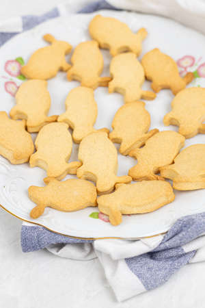 Preparing easter bunnies for baking in the baking tray.
