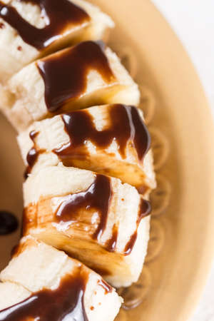 Closeup macro sliced banana with chocolate cream.の写真素材
