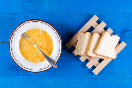 Flat lay mixed eggs with toast bread for french toast.の写真素材