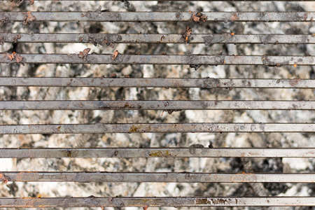 Empty barbecue grill with embers under barbecue grill