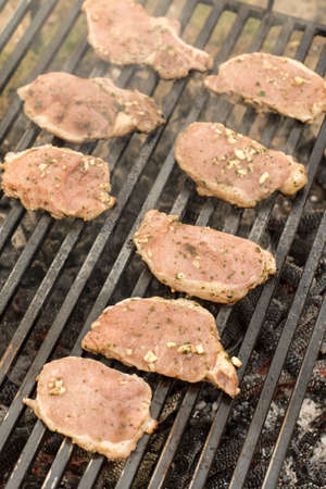 Marinated pork chops on the barbecue grill