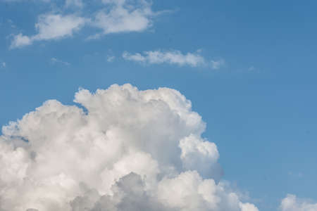 White cloud formations on the blue sky. Abstract heaven background with white clouds.の写真素材