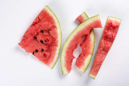 Watermelon leftovers isolated above white background.の写真素材