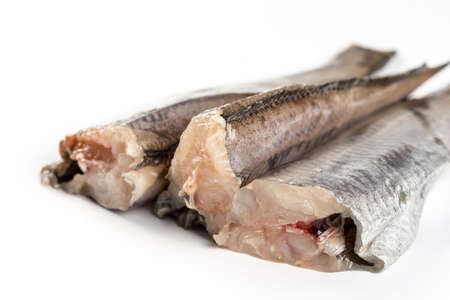 Fresh raw hake fish isolated over white background.の写真素材