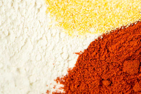 Mixture of flour red paprika and corn flour in the bowl.の写真素材