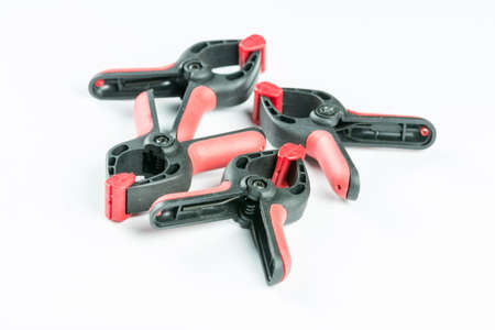 Plastic carpenters pinch tools isolated over white background.の写真素材