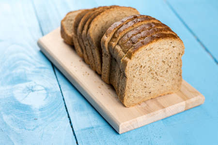 Slices of bread on the kitchen cutting board.