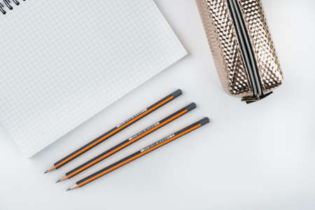 School notebook with wooden graphite pencils and pencil case with copy space.の写真素材