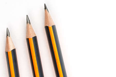 Wooden graphite pencils above white background with copy space.の写真素材