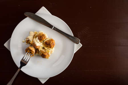 Flat lay above sliced meatballs with cheese served on the plate.の写真素材