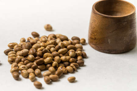 Soya beans with wooden pot on the white marble background.の写真素材