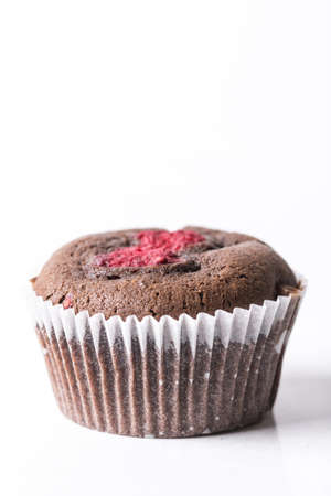 Chocolate cup cake muffin with fresh raspberry isolated on the white background with copy space.の写真素材