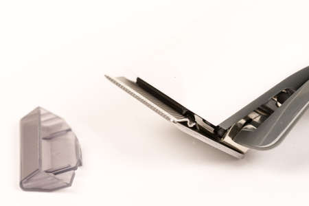 Closeup macro of white hair trimmer isolated above white background.の写真素材