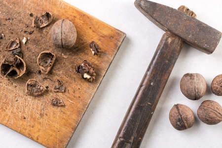 Ham, wooden board and nuts for cleaning.