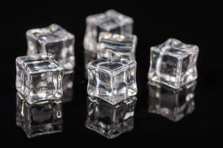 Ice cubes on the black background with reflections.の写真素材