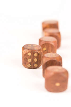 Selective focus on wooden gambling dice with individuality concept.
