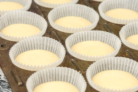 Raw vanilla cupcake muffins ready for baking.
