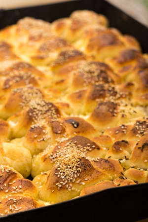 Fresh and hot baked rolls on the plate.の写真素材